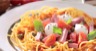 Jambonneau billes de mozzarella et tomates cerise en nid de spaghetti