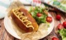 Hot-​dog saucisse fumée aux légumes du soleil